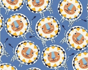 Può includere: Un tessuto blu con un motivo ripetuto di leoni gialli e bianchi con occhi blu. I leoni sono circondati da un motivo a raggiera giallo e bianco.