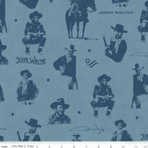 May include: A blue and white fabric print featuring a repeating pattern of John Wayne's image in various poses, including riding a horse, holding a gun, and wearing a cowboy hat. The fabric also includes the text "John Wayne" and stars.