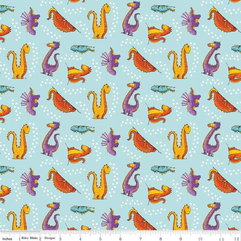 May include: A repeating pattern of colorful dragons on a light blue background with white polka dots. The dragons are in various poses, including flying, sitting, and standing. The dragons are all different colors, including orange, yellow, purple, and blue.