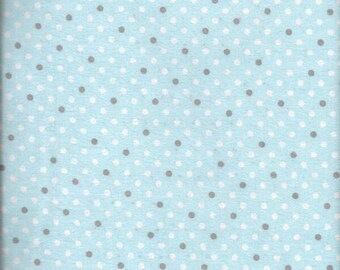 May include: A light blue fabric with a repeating pattern of white and gray polka dots. The dots are evenly spaced across the surface, creating a simple and classic design. The fabric appears to be soft and suitable for various craft projects.