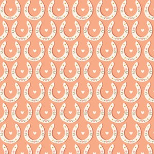 May include: A repeating pattern of white horseshoes with floral and heart details on a peach background. The horseshoes are arranged in rows and columns, creating a visually appealing and symmetrical design.