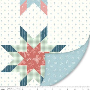 May include: A patchwork quilt with a star design. The star is composed of various fabrics, including gingham, striped, and solid patterns in shades of blue, coral, and green. The background is a cream color with a small blue floral pattern. The quilt measures 30 cm.