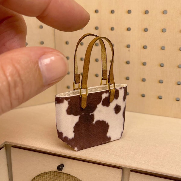Mini borsa in tela con stampa effetto pelle di mucca