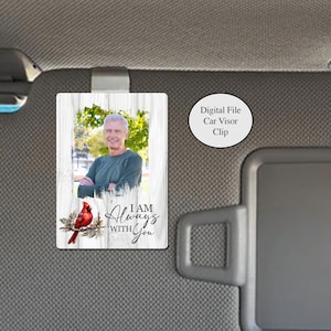 May include: A rectangular car visor clip featuring a photo of a man with the text "I AM Always with You". A red cardinal is perched on a branch. The background is a white wood design. The text "Digital File Car Visor Clip" is also present.