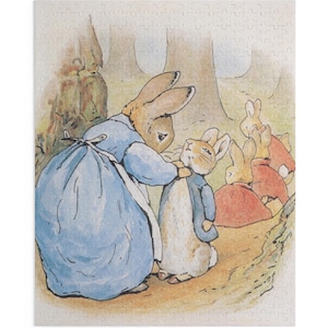 May include: A jigsaw puzzle depicting a scene from the Peter Rabbit stories. A mother rabbit in a blue dress and apron comforts a young rabbit in a blue jacket. Other rabbits in red and orange outfits are in the background, near trees.