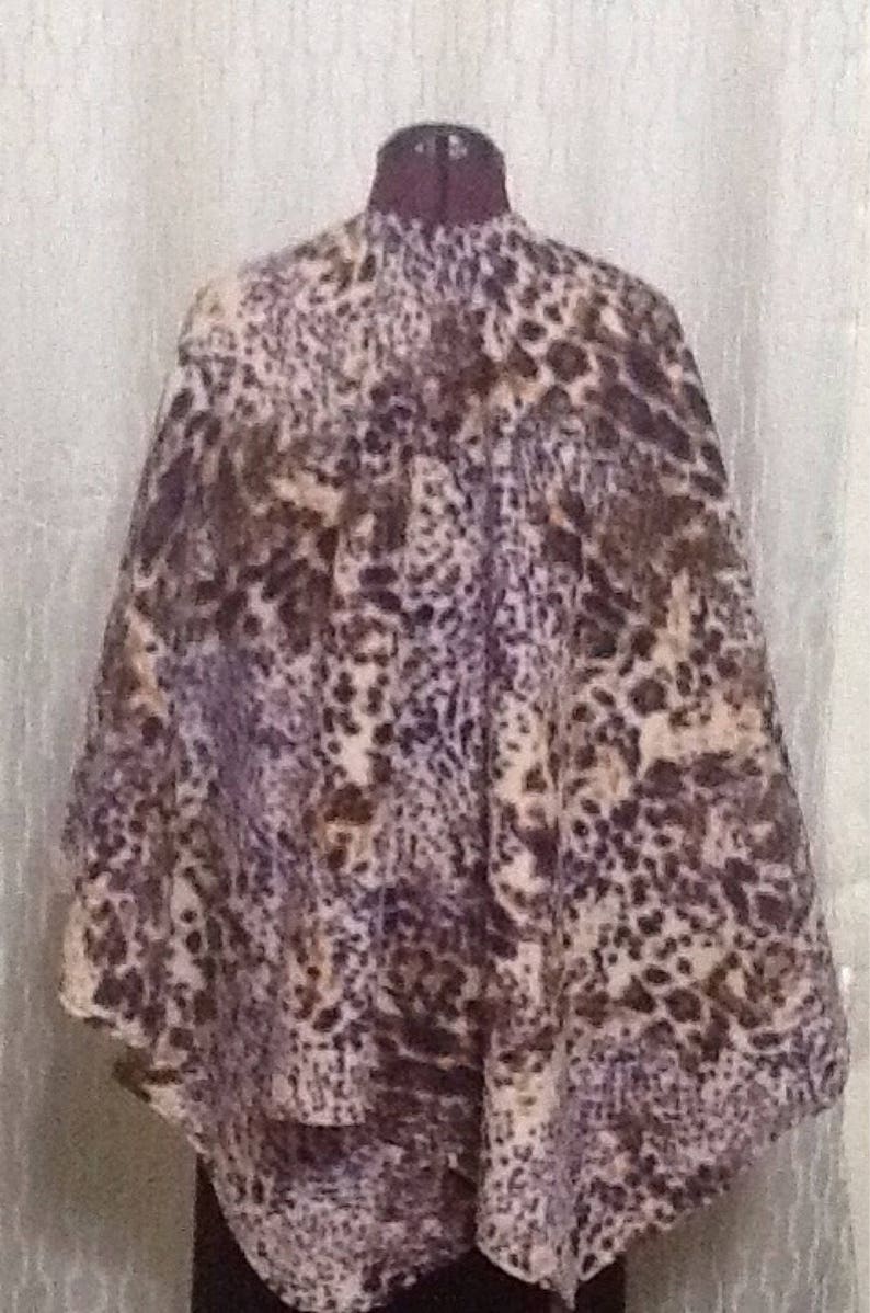 Snow Leopard Shawl with a twist. Colors are unique with Etsy