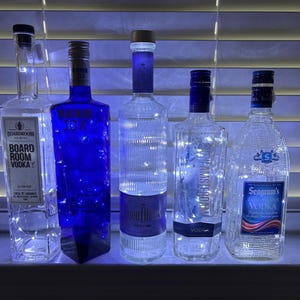 Liquor bottles with battery operated lights