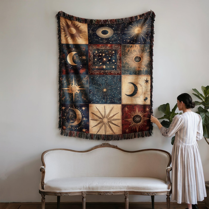 a woman standing in front of a wall hanging on a wall