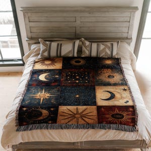 a bed that has a blanket on top of it