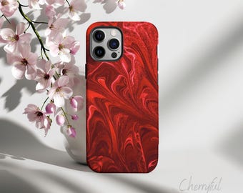 May include: Red and white abstract swirl pattern phone case for an iPhone.