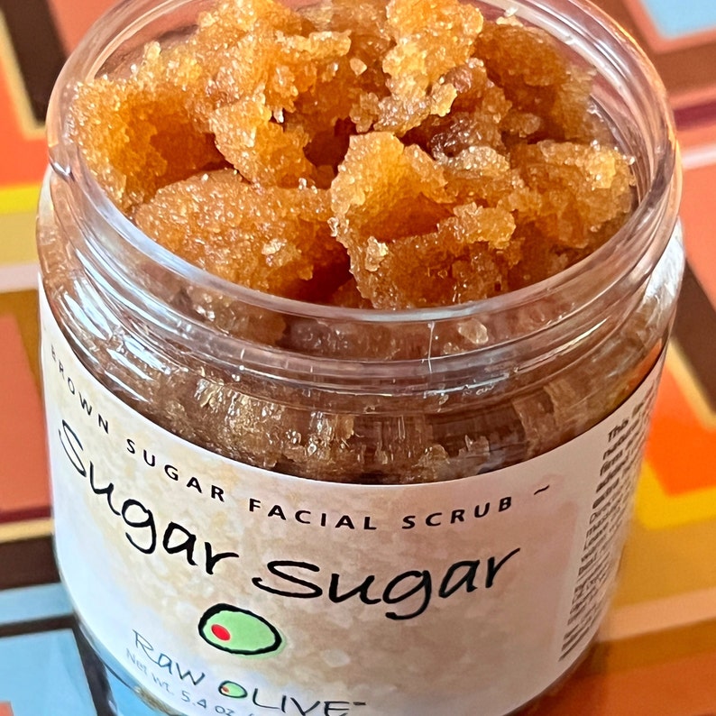 top view and side of a clear jar with brown sugar facial scrub, Raw Olive, moisturing and exfoliating natural scrub, Sugar Sugar