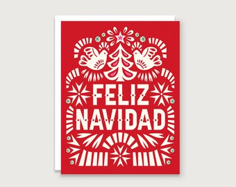 May include: A red Christmas card with white decorative elements and the words "FELIZ NAVIDAD" in large white letters. The design includes doves, a Christmas tree, and starbursts.