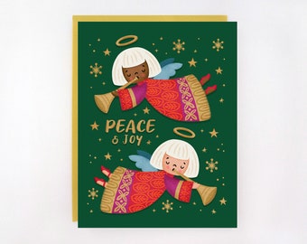 May include: A Christmas card with a green background and gold border. Two angels in red and purple robes play trumpets. The words "PEACE & JOY" are written in gold. Gold stars and snowflakes decorate the background.