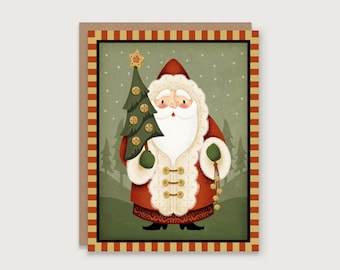 May include: A Christmas card featuring Santa Claus holding a decorated Christmas tree. Santa is dressed in a red suit with white fur trim and gold buttons. The card has a decorative border with red and gold stripes.