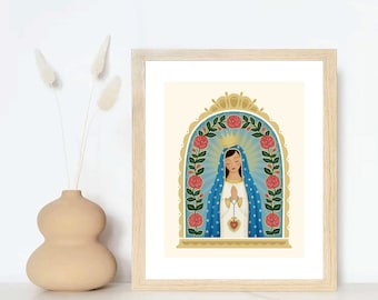 May include: A framed print of a religious image depicting the Virgin Mary in a blue robe with a crown and a red heart. The image is surrounded by a gold frame and a wreath of red roses.