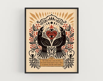 May include: Framed art print featuring two black crows flanking a heart with an eye, surrounded by floral and celestial motifs. The artwork includes the text "TWO CROWS CALL: LOVE OR FATE, THE HEART DECIDES WHAT IT WILL TAKE, AS SHADOWS STIR AND SPIRITS WAKE."