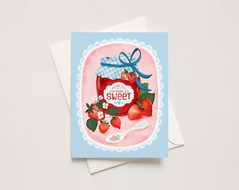 May include: A greeting card with a light blue background and a white lace border. The center features a red jar of strawberry jam with a blue gingham lid, a blue ribbon, and the text THANK YOU FOR BEING SO SWEET. Strawberries and a spoon are below.