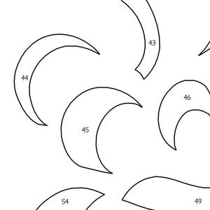 May include: A collection of black outline shapes, including crescent moons and curved lines, against a white background. The shapes are numbered, with the largest being a crescent moon labeled "44".