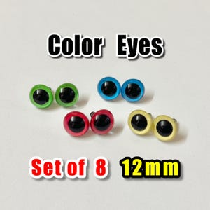May include: A set of eight 12mm color eyes in green, blue, red, and yellow. Each eye has a black pupil. The text "Color Eyes" and "Set of 8 12mm" are displayed in the image.