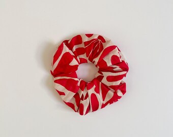 Coletero beige y rojo
