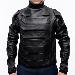 May include: A black leather jacket with a high collar and multiple horizontal panels across the chest. The jacket features a unique design with button and zipper details, and fitted sleeves. The garment is a stylish piece of outerwear.