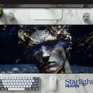 May include: A large rectangular desk mat featuring a detailed illustration of a classical statue with a cosmic design. The statue is gray and gold, with a blue and gold cosmic overlay. The text "Starlight HEAVEN" is in blue.