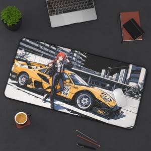 May include: A rectangular mouse pad featuring an anime-style illustration of a yellow sports car with a woman in a black outfit. The background depicts a cityscape. A computer mouse is visible.