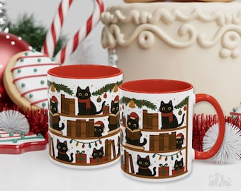 May include: Two white ceramic mugs with bright red interiors and handles, featuring a repeating illustration of black cats sitting on wooden bookshelves among Christmas decorations, wrapped gifts, and books, with a festive holiday theme.