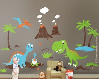 May include: A set of dinosaur wall decals featuring a green T-Rex, a blue dinosaur, a pterodactyl, and two brown volcanoes with white clouds. The decals are on a gray wall with a green palm tree and a blue pond.