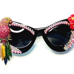 May include: A set of three ceramic mugs with a speckled, matte finish. The mugs are in shades of cream, light gray, and dark gray. Each mug has a simple, minimalist design and a rounded handle.