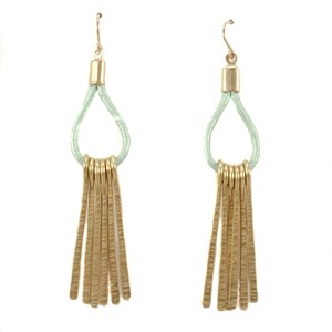 May include: A pair of gold tassel earrings with a light green leather loop. The tassels are made of multiple thin, textured gold bars.