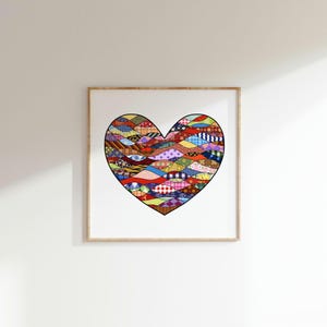 May include: A framed print of a colourful heart made of different patterned fabrics. The heart is a patchwork of various colours and designs, including red, blue, green, yellow, and purple.