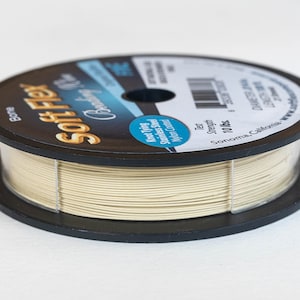 May include: A spool of bone coloured Soft Flex knot tying wire. The label reads "Soft Flex Knot Tying Stainless Steel Nylon Coated" and "Test Strength 10 lbs."  Sonoma, California.