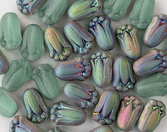 May include: An assortment of iridescent glass beads in a flower bud shape. The beads have a mix of colors, including green, blue, and gold, with a frosted finish. The beads are approximately 0.5 inches in length, perfect for jewelry making.