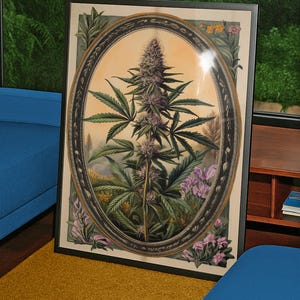 May include: Framed botanical print featuring a cannabis plant within an oval frame. The artwork showcases a detailed illustration of the plant with green leaves and purple buds, surrounded by floral elements. The frame is black, and the background is a warm, neutral tone.