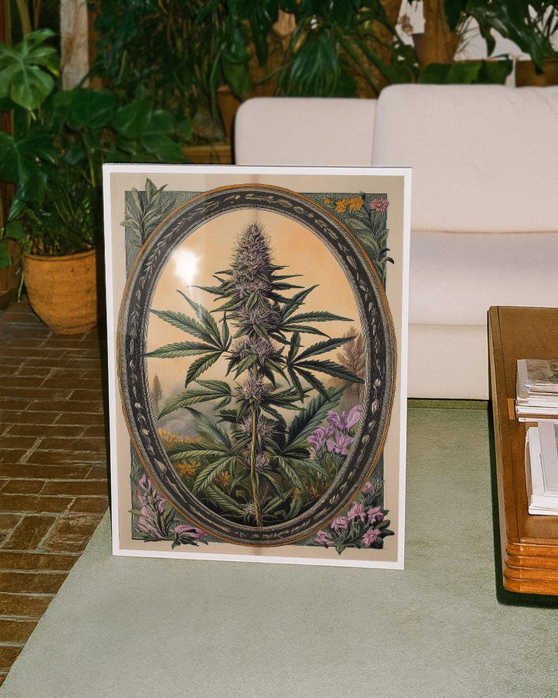May include: A framed botanical print featuring a cannabis plant in an oval frame. The artwork showcases the plant's leaves and purple buds, set against a soft, warm background. The print is surrounded by a white border and floral accents.