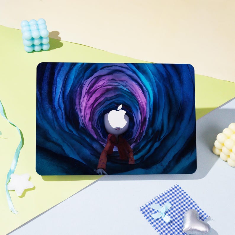 May include: A laptop skin featuring a surreal illustration of a figure with an Apple logo head emerging from a swirling tunnel of blue and purple hues. The figure wears a red jacket. The background is a mix of yellow, green, and blue.