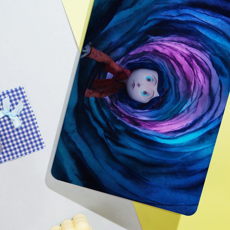 May include: A rectangular mousepad featuring a stylized illustration of a character falling into a swirling vortex of blue and purple hues. The character is wearing a red jacket. A small gift box with a blue and white checkered pattern is in the corner.