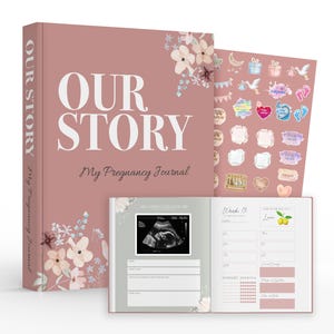May include: A pink pregnancy journal with the title "Our Story" and a floral design. The journal includes a section for ultrasound photos, weekly updates, and a sticker sheet with various baby-themed designs.
