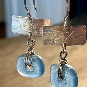 Sterling silver dangle earrings with blue glass beads