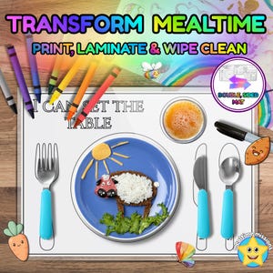 May include: A white rectangular placemat with the text I CAN SET THE TABLE, featuring outlines for a fork, knife, and spoon. A blue plate with a sheep-shaped food arrangement sits in the center, surrounded by colorful crayons and a black marker.