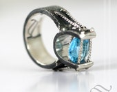 Topaz in Suspension Tension! Swiss Blue Topaz in a Sterling Silver ring