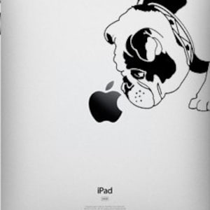 May include: Black and white silhouette of a pug dog sniffing an apple logo on a silver iPad.