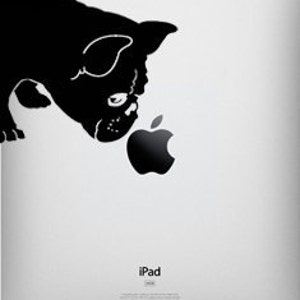 May include: Black silhouette of a French bulldog looking at an Apple logo on the back of a silver iPad.