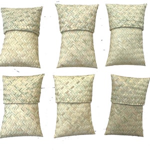 May include: Six woven rectangular pillows with a light brown color. The pillows are made of a natural material and have a woven pattern.