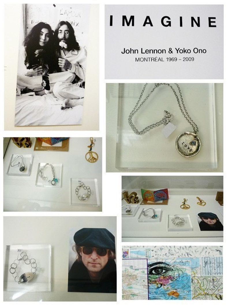May include: A black and white photo of John Lennon and Yoko Ono, a silver chain necklace with a silver charm that says "LOVE" in all caps, a collection of silver bracelets and charms, a photo of John Lennon wearing a black cap and sunglasses, and a map with a blue eye drawn on it.