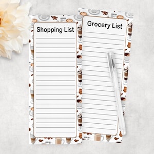 May include: Two white lined notepad pages with a coffee cup pattern. The top page has the text "Grocery List" and the bottom page has the text "Shopping List".