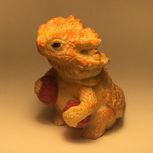 Bearded dragon cutie with berries figurine yellow orange