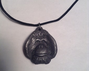 LInus orangutan pendant necklace center for great apes