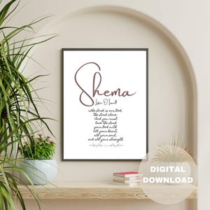 May include: A printable digital download of a Shema prayer in a brown cursive font on a white background. The text reads "Shema - Listen, O Israel - The Lord is our God, the Lord alone. And you must love the Lord your God with all your heart, all your soul, and all your strength."